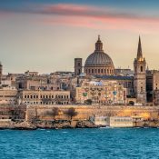 Valletta, Malta: skyline from Marsans Harbour at sunset. The cathedral